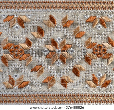 embroidered element on flax by silk threads Royalty-Free Stock Photo #376488826