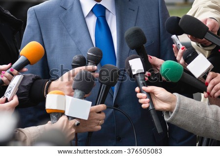 Journalists interviewing VIP Royalty-Free Stock Photo #376505083
