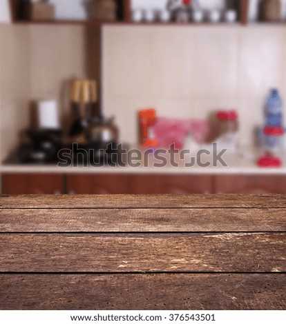 unfocused picture of home kitchen with wood table