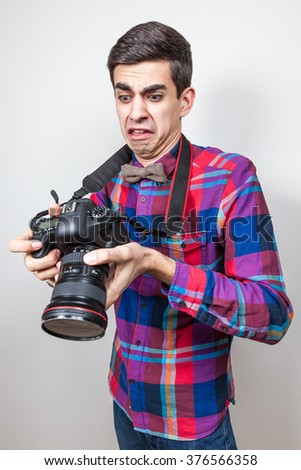 A young man with camera