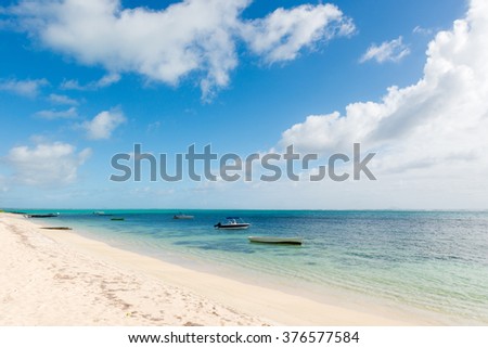 Sunny picture of tropical beach on the east coast of Mauritius Island. Beautiful view of the lagoon of a tropical island in the Indian ocean