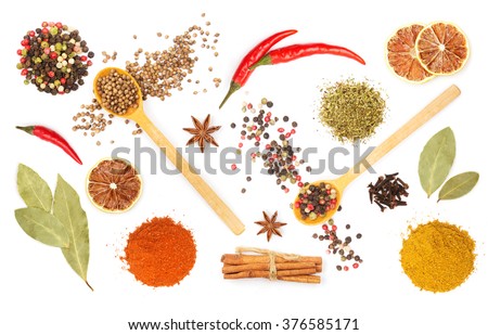 Colorful spices and herbs for cooking background and design isolated Royalty-Free Stock Photo #376585171
