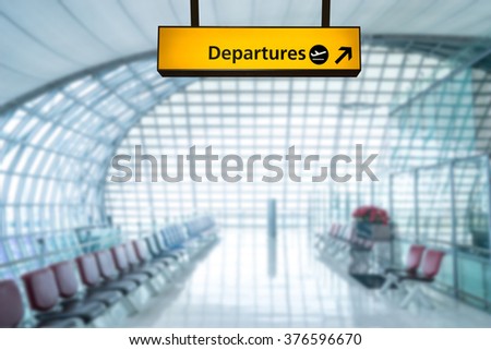 Airport sign departure and arrival board Royalty-Free Stock Photo #376596670