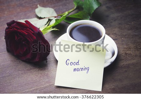 coffee, rose and '' good morning '' writing on paper