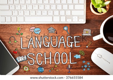 Language School concept with workstation on a wooden desk 