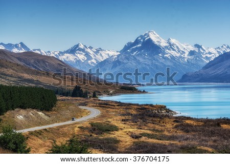 mount cook viewpoint with the lake pukaki and the road leading to mount cook village. Taken during summer in New Zealand. Royalty-Free Stock Photo #376704175