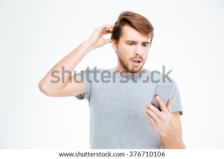 Amazed man looking on smartphone isolated on a white background