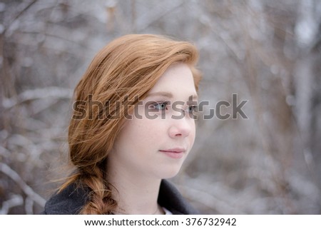 Redhead teenage girl profile picture with winter background
