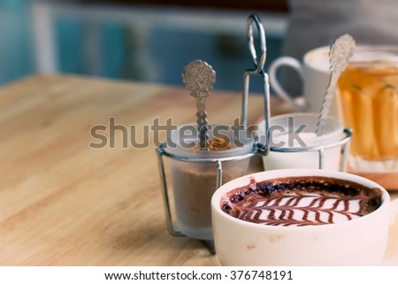 Coffee cup and sugar set in coffee shop.