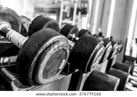 fitness dumbbells, weights equipment, selective focus, fitness club, black and white photography