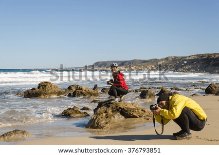 Two photographers taking pictures of the great wave. Mediterranean Sea, Cyprus