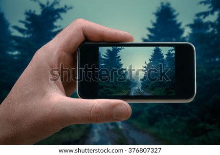 mountain scenery, nature in the mountain heights Photo by man photographed on a smartphone, morning fog in the forest
