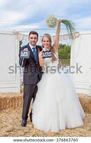 bride and groom newly married at wedding reception. ,