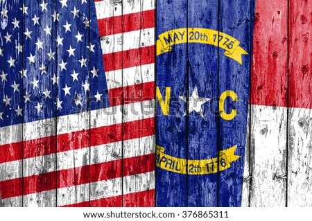 Flag of US and North Carolina painted on wooden frame