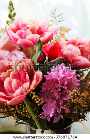 Bouquet of different flowers including tulips and mimosa
