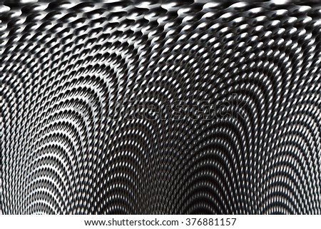 Wide angle photo of curved metal surface with texture resembling shagreen. Precision foundry. Material background. Supporting black and white photo on the subject of technology, industry or science. Royalty-Free Stock Photo #376881157