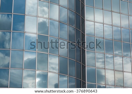 Blue Sky and Clouds Reflected in the Glass Building