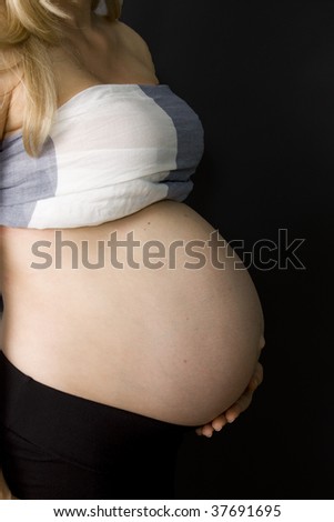 Belly of a pregnant  woman expecting twins