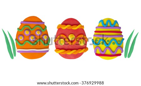 Easter eggs colour plasticine crafts on a white background