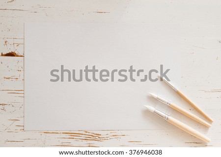 White paper and child stationery, top view, copy space
