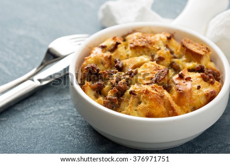 Breakfast strata with cheese and sausage in small baking dish Royalty-Free Stock Photo #376971751