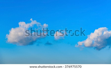 white clouds on the blue sky
