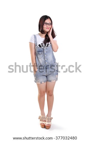 Full length portrait of cute happy nerdy girl with adorable smile, isolated on white background
