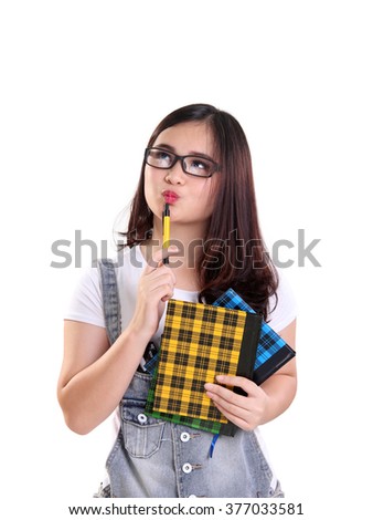 Portrait of cute nerdy Asian teenage girl imagining something above, isolated on white background