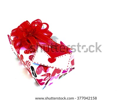 Gift with valentine card on white background