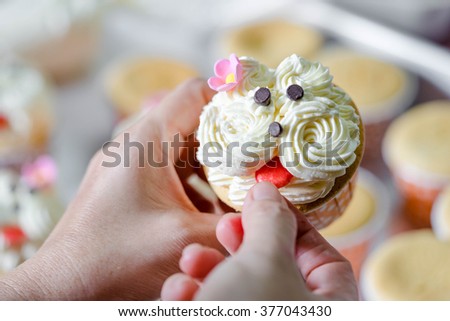 chef making cupcakes with vanilla cream