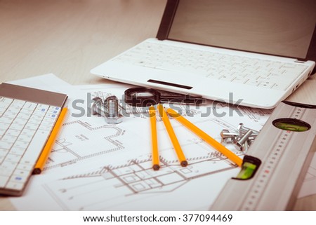 photo Architectural plans with the architect working tools on a light background