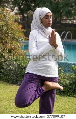 Beautiful Muslim Lady is Practicing Yoga Outdoor