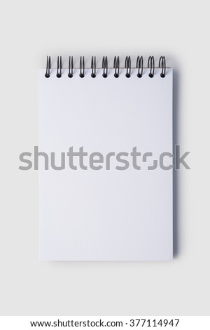 Open notebook with shadow  on white background