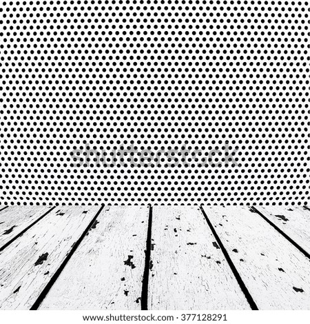 background made of white wooden floor and black dots on silver metal wall in square form