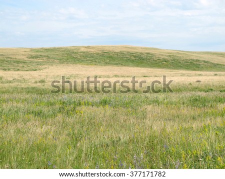 Steppe hills against a blue sky 