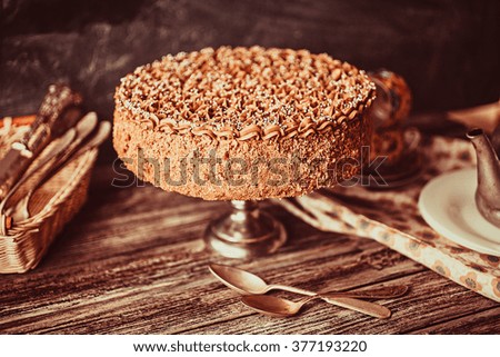 Homemade chocolate cake in rustic style on vintage background. Shallow depth of field.