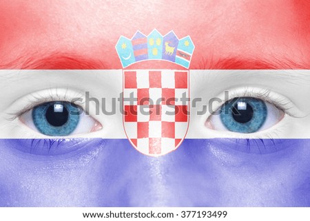 child's face with croatian flag 