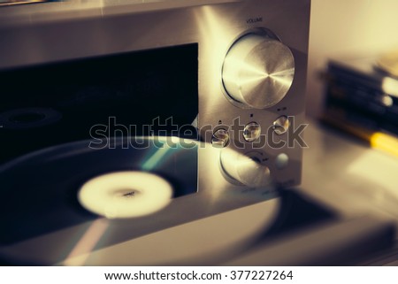 Audio CD player done with a vintage retro instagram filter Royalty-Free Stock Photo #377227264