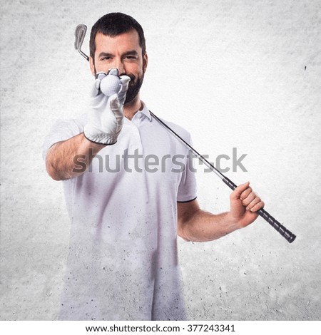 Golfer man over textured background