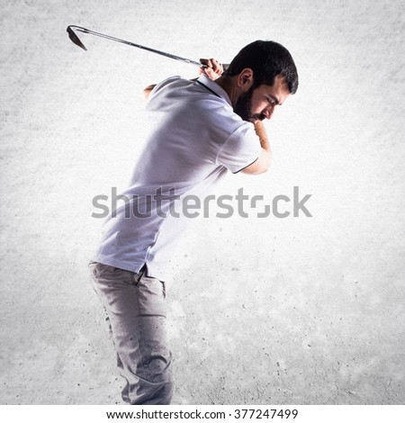 Golfer man over textured background