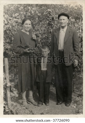 Family portrait in garden. Ukraine (composed USSR), mid 20 century