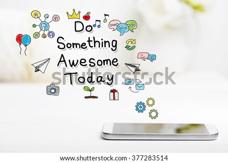 Do Something Awesome concept with smartphone on white table