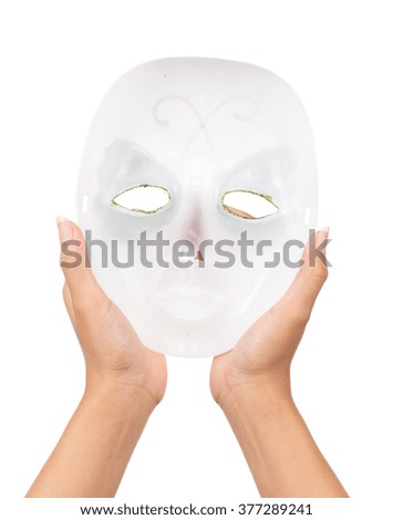  hand of a young woman holding a carnival mask isolated on white background