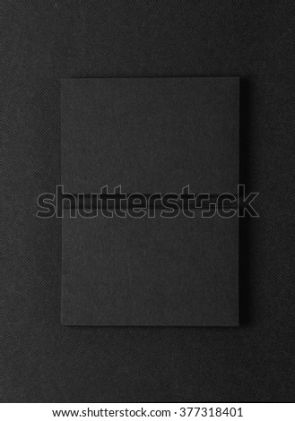 Photo of two stack Of blank black business cards on textile background. Vertical