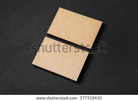 Photo of two stack Of blank craft business cards on textile background 