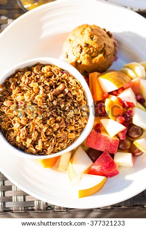 flat lay picture of healthy breakfast of granola and fruits