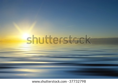Colourful sunrise on quiet water