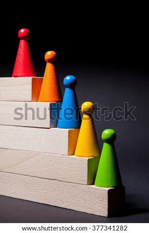 Playing chips on the wooden stairs, black background