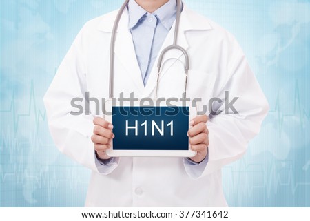 Doctor holding a tablet pc with H1N1 sign on blue background Royalty-Free Stock Photo #377341642