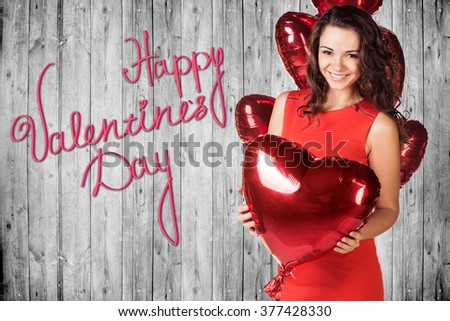 Happy Valentines Day on a gray wooden wall